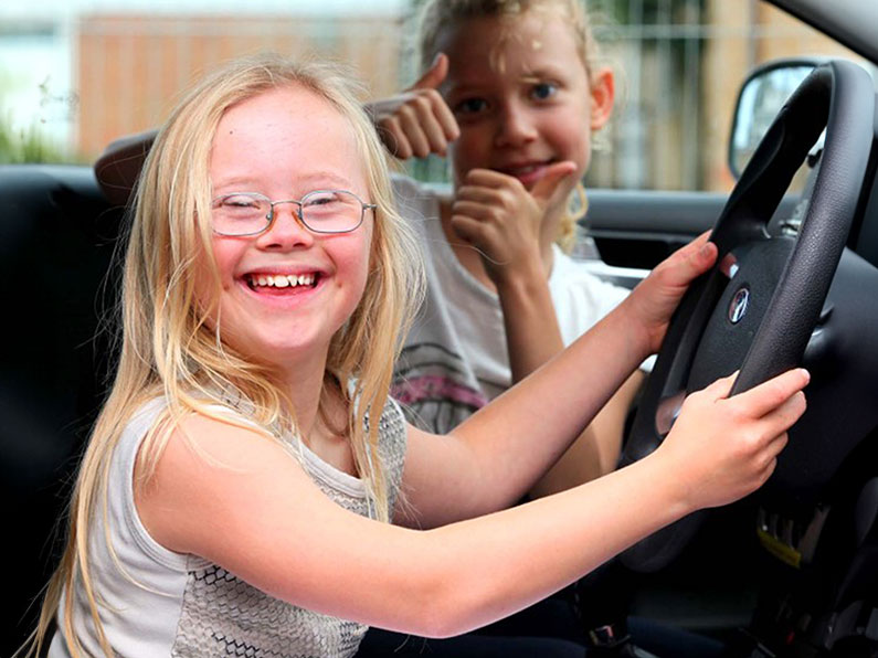 Girl at wheel of car