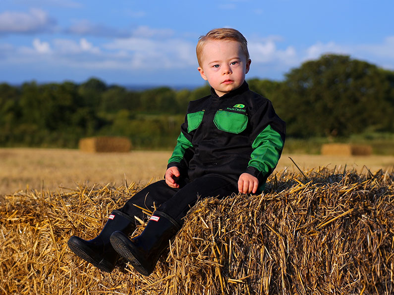 £20000 to support local families boy sitting on a bail of hay